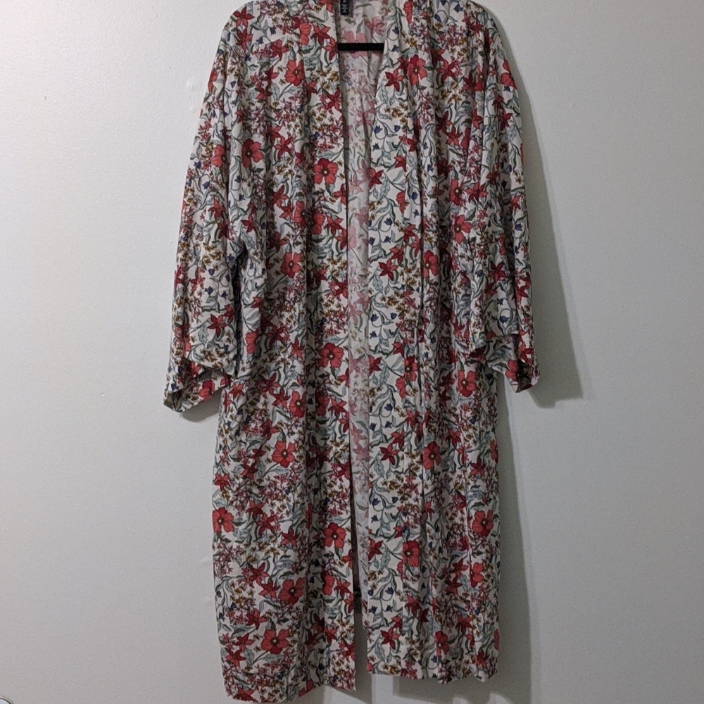 Long festive flowery cover. Rarely worn